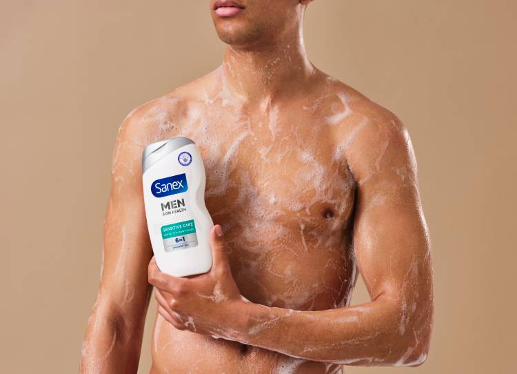 man holding Sanex Men shower gel  