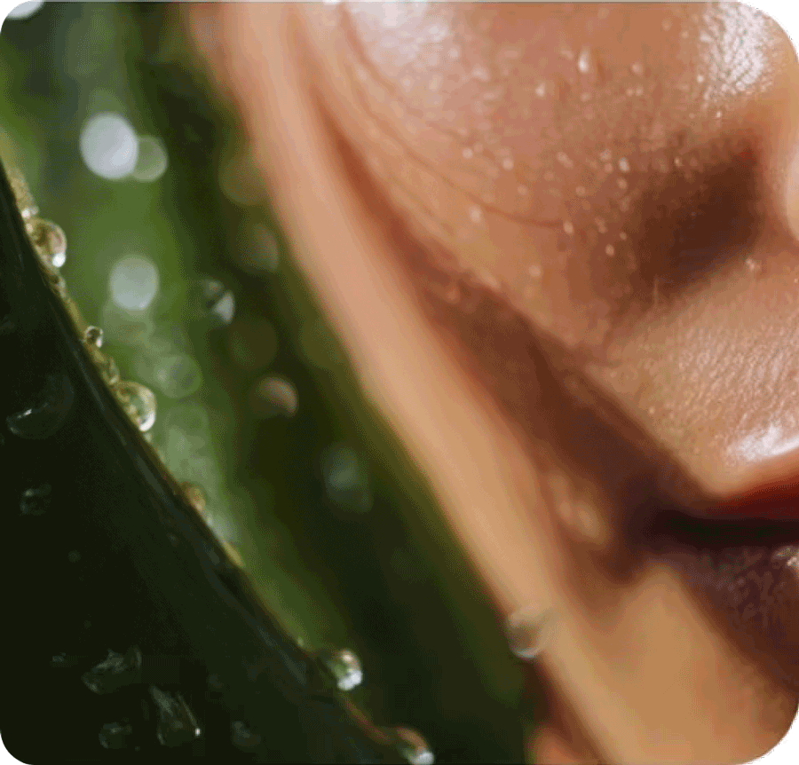 A close-up view showing clean, wet skin with water droplets next to a fresh green leaf or plant with water drops on it, surrounded by soft green bokeh.