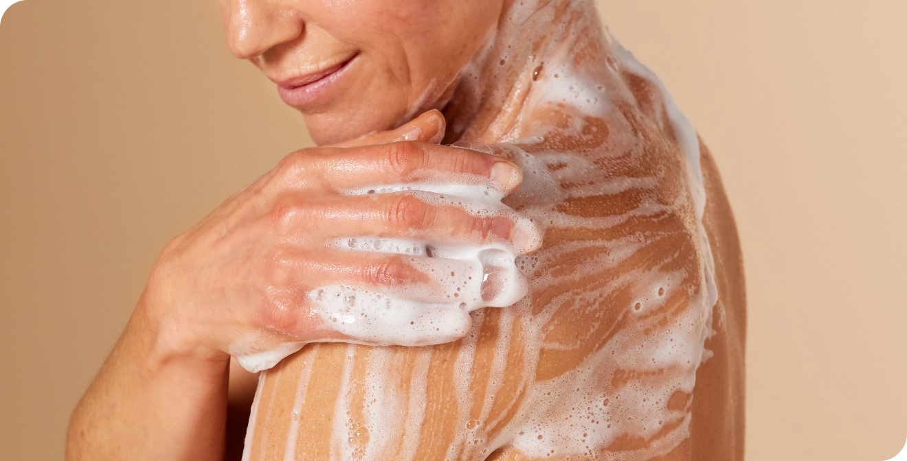 Woman cleaning the skin at shower